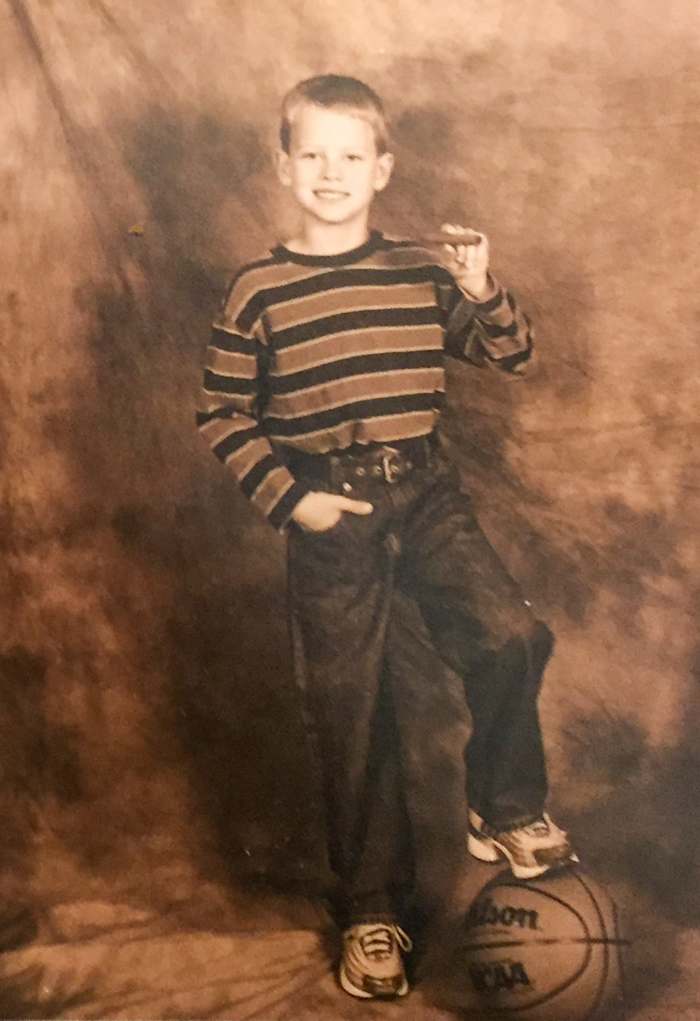 Joe Burrow, at age 7, continuing the family's cigar-posing tradition.